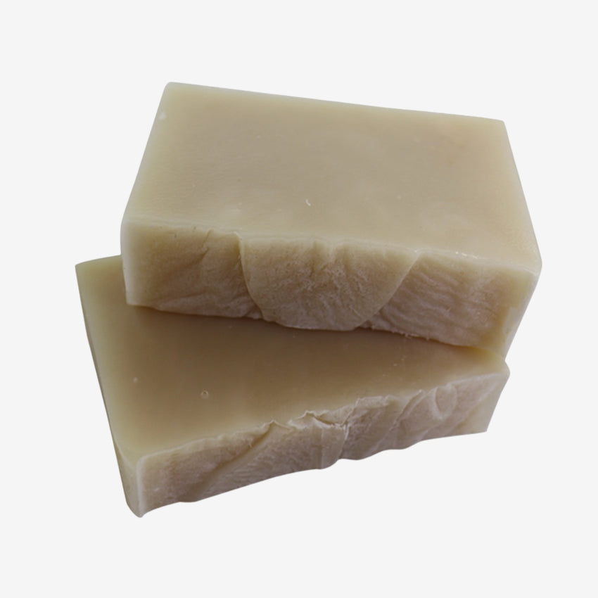 The Anoint Baby Shea Butter Soap Bar unwrapped on a blank background