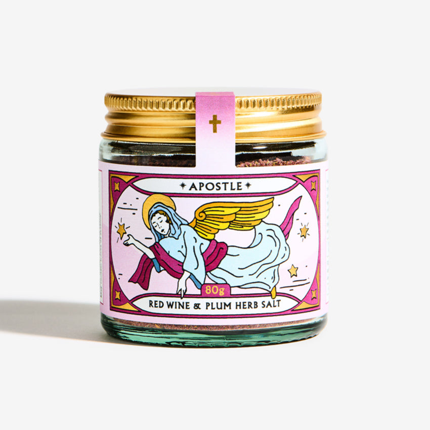 The Apostle Red Wine & Plum Herb Salt Seasoning jar on a grey background