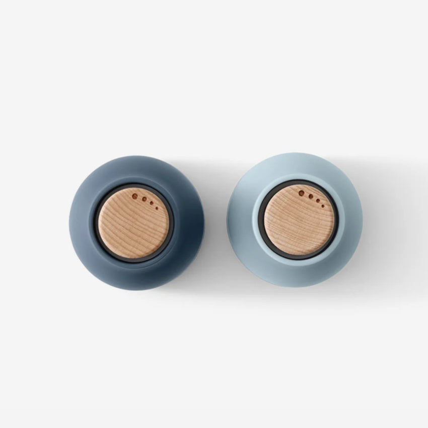 A top view of the small Audo Salt and Pepper Grinder in Blues and Beech on a blank background