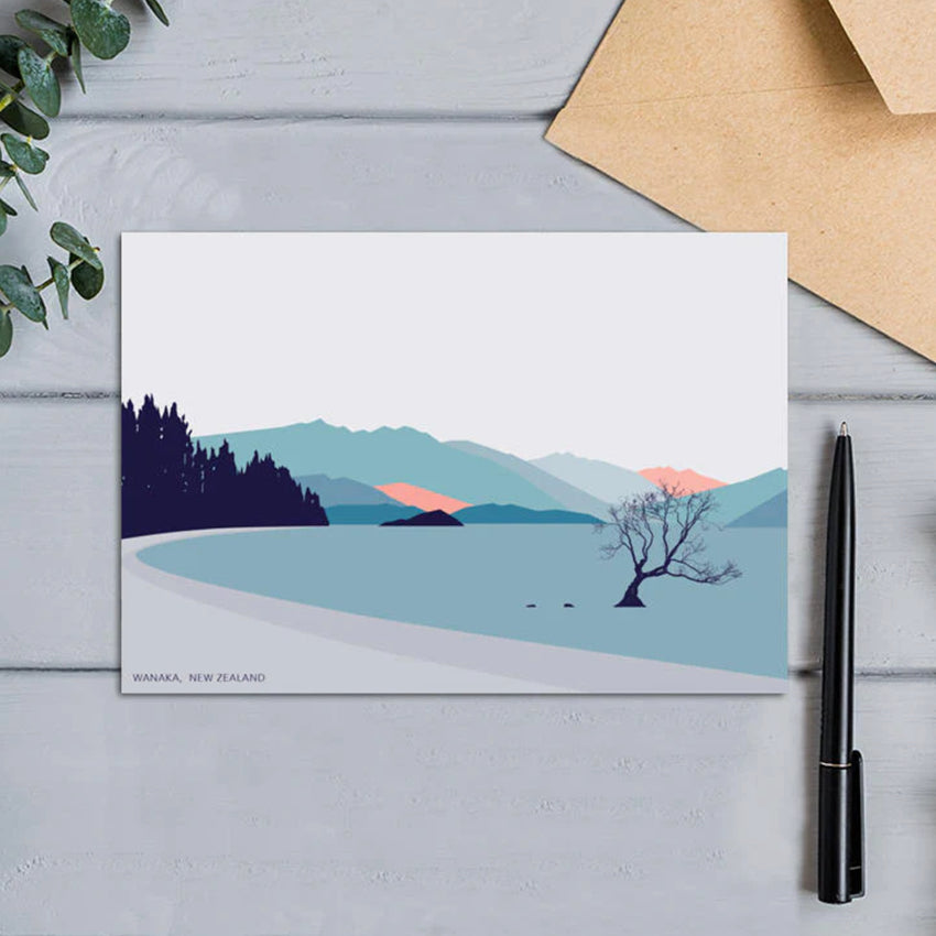 The Bridget Hall Wanaka Tree Gift Card next to a pen and envelope