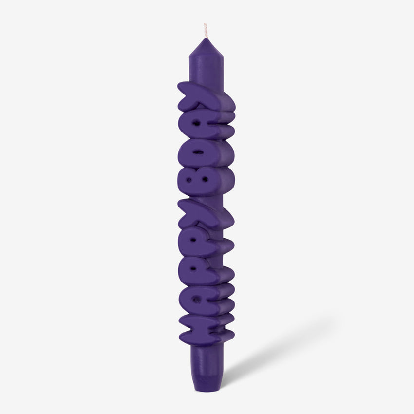 The CandleHand Happy Bday Taper Candle in purple on a grey background