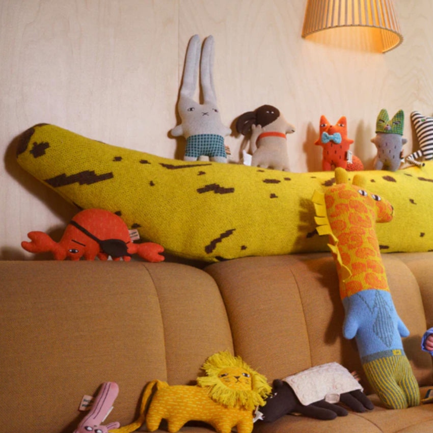 The Donna Wilson Wee Ones on a brown couch