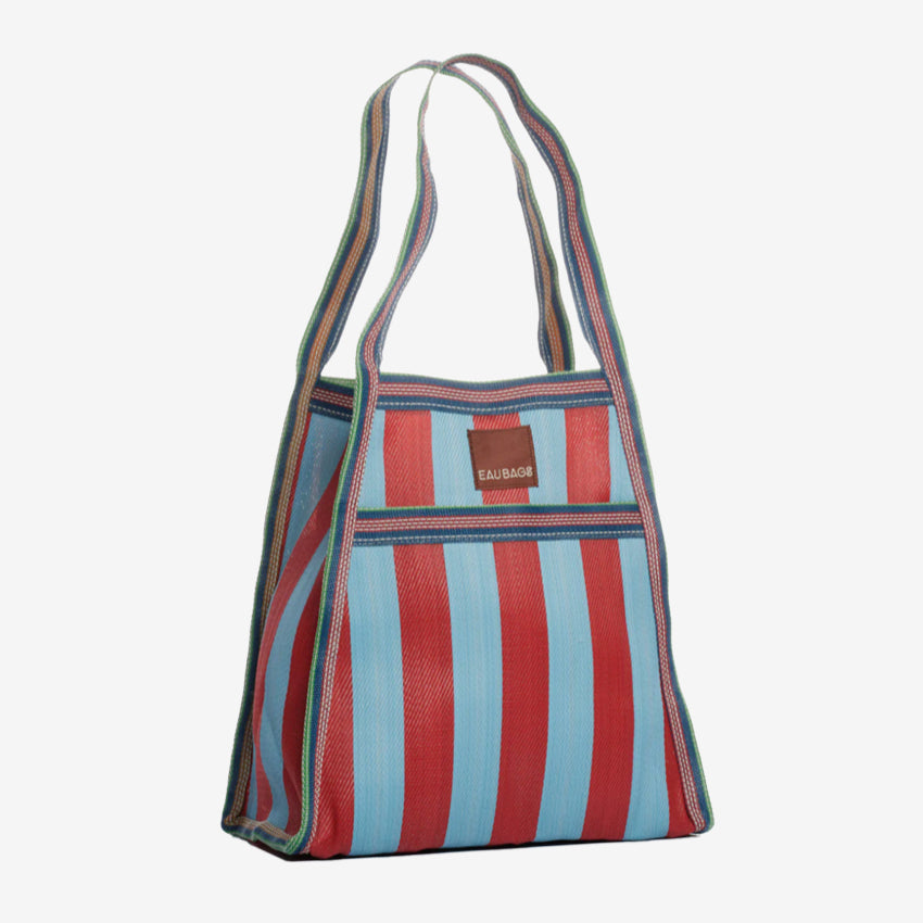 The EAU Sac Bag in Club Rouge on a grey background