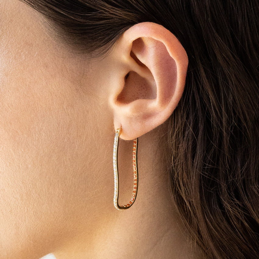 The Nina Gordon Fiasco Paved Hoops in Gold on a model