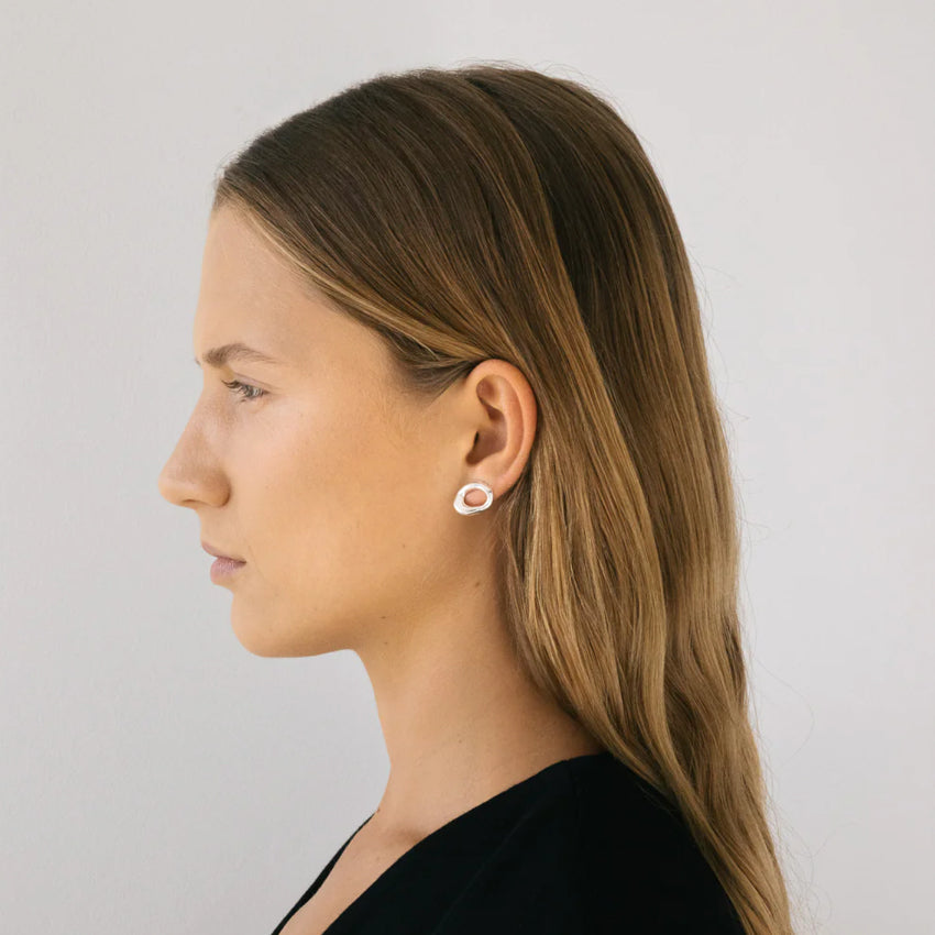 The Nina Gordon Verge Studs in Silver on a model