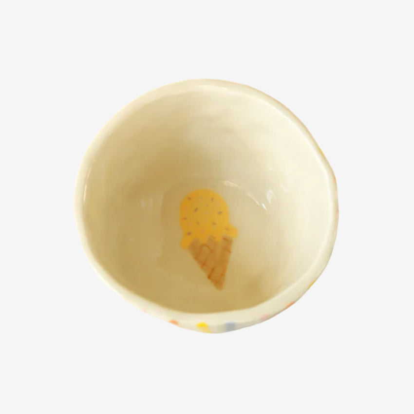 The inside of the Flossie By Nature Striped Ice Cream Bowl on a grey background