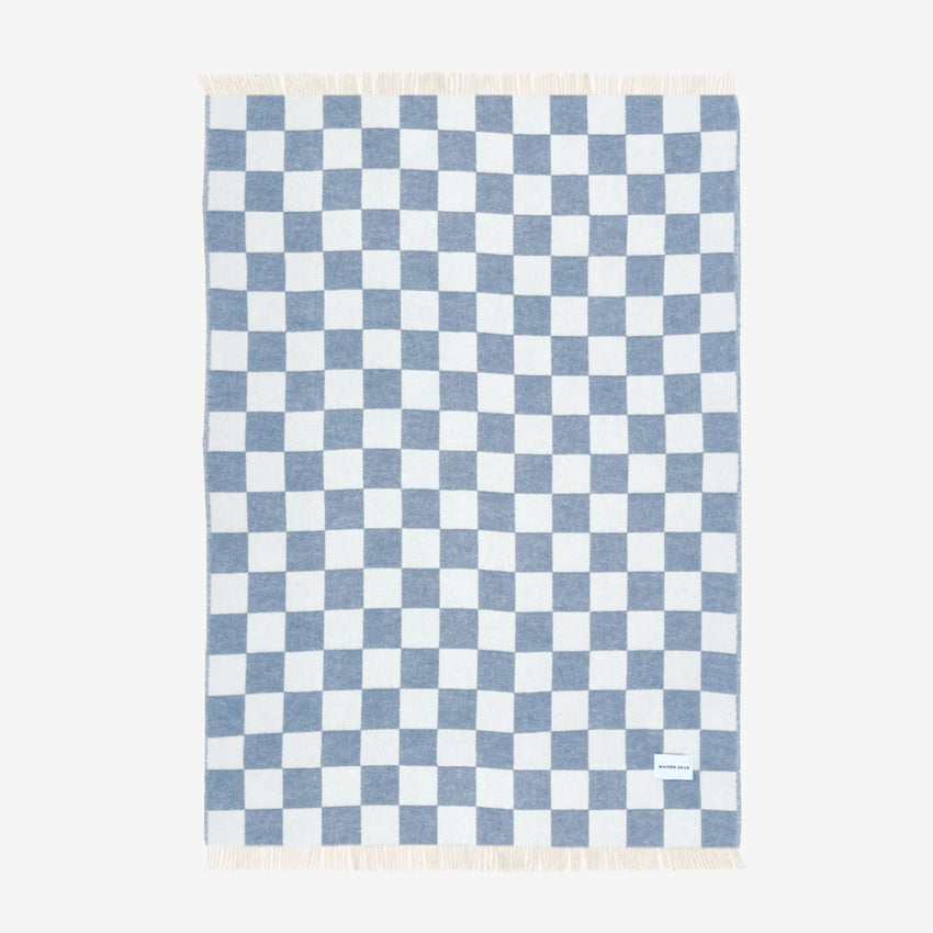 Maison Deux Checkerboard blanket in Denim on a blank background