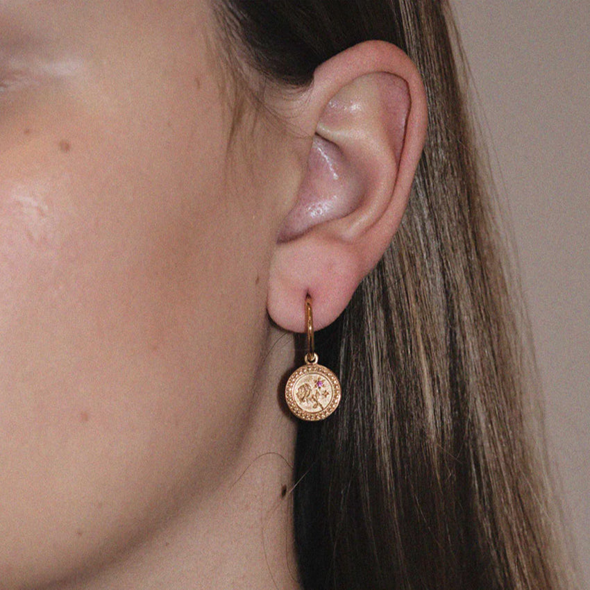 The Meadowlark Amulet Love Signature Hoops featuring 2 round brilliant cut pink sapphires in Gold Plated on a model
