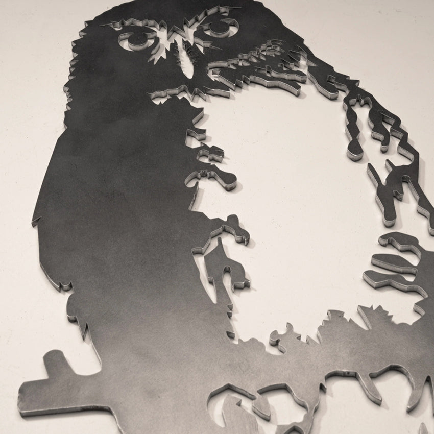 A closeup of the Metalbird Ruru garden sculpture on a blank background