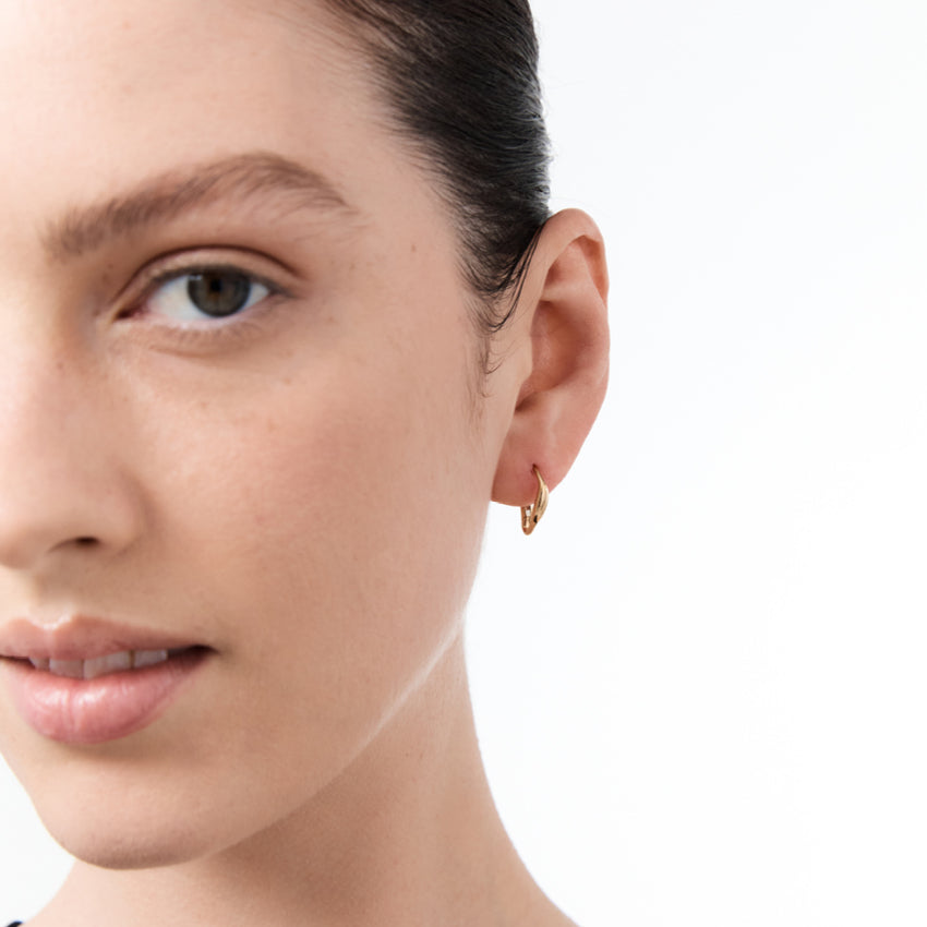 The Nina Gordon Version Hoop in Gold Vermeil on a model