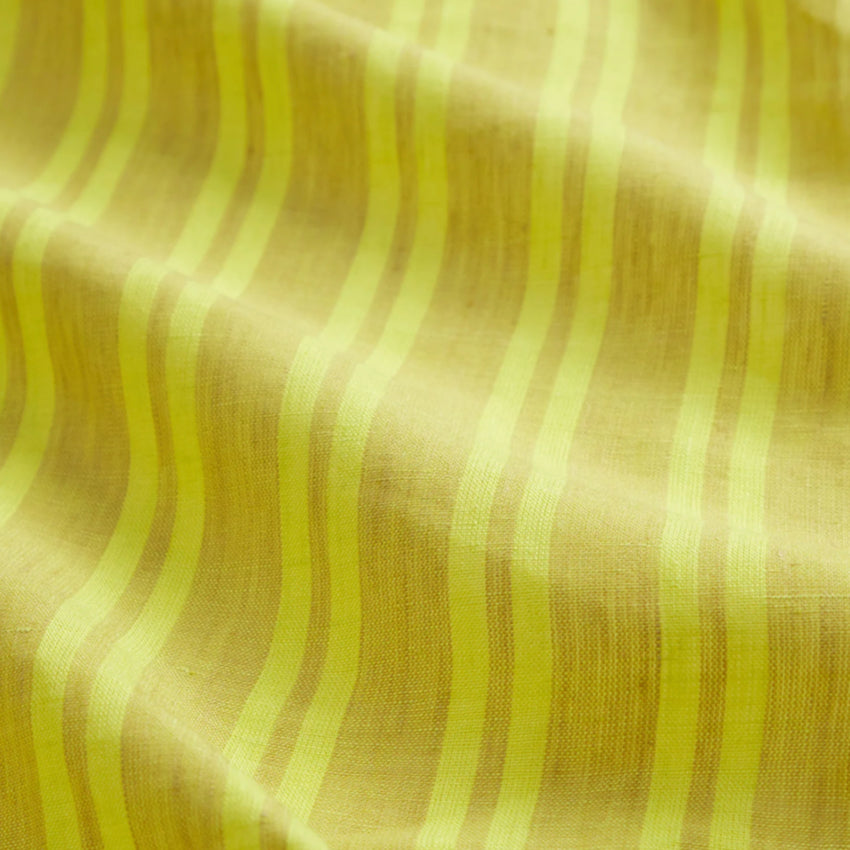 A closeup of the Sage x Clare Nadine Linen Duvet Cover in Olive