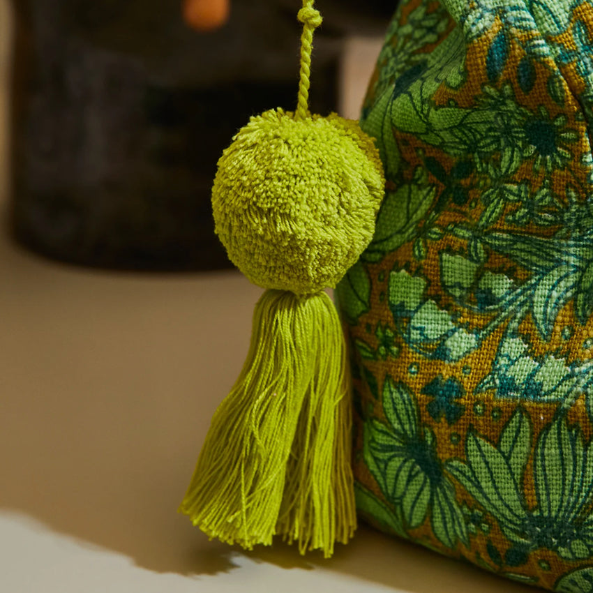 A close up of the Sage x Clare Evette Cosmetic Bag