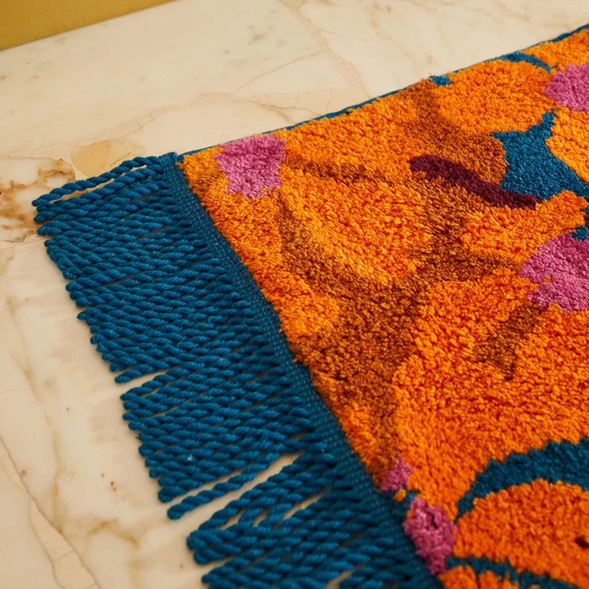 A close up of the Sage x Clare Genevieve Bath Mat in Capri