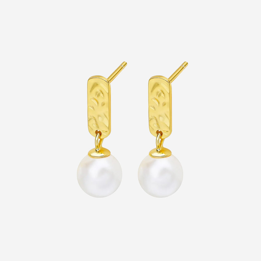 The Silver Linings Collective Luna Pearl Earrings in Gold on a blank background