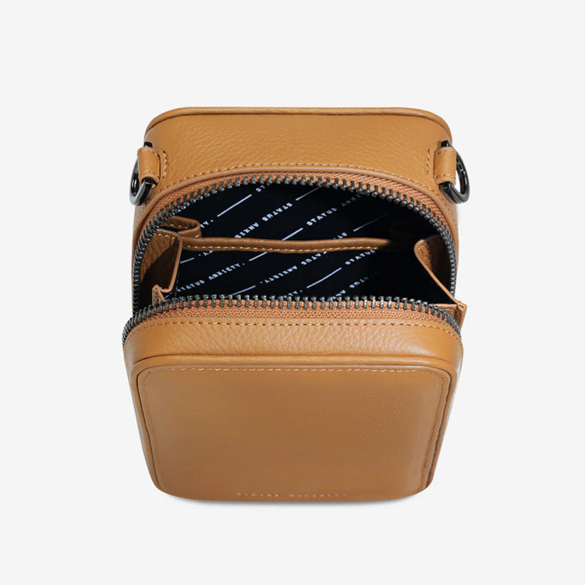 A top view of the Status Anxiety Good Life Bag in Tan open on a blank background