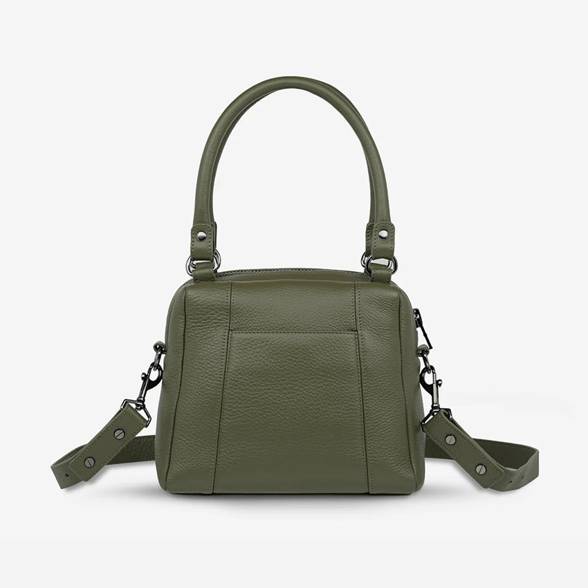 The back of the Status Anxiety Mini Mountains bag in Khaki on a blank background