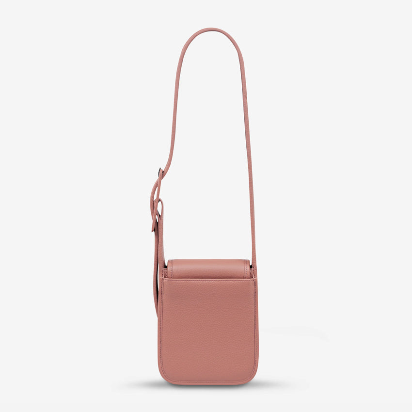 The back of the Status Anxiety Perplex Bag in Dusty Rose on a blank background