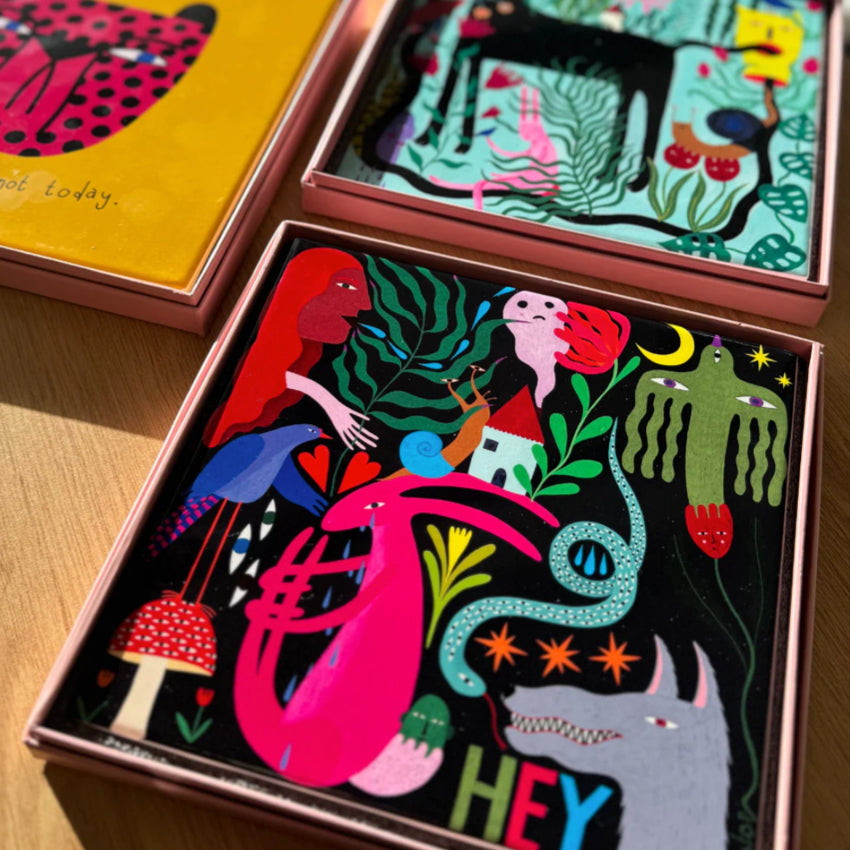 The Studio Soph Hey Art Tile in its box next other art tiles