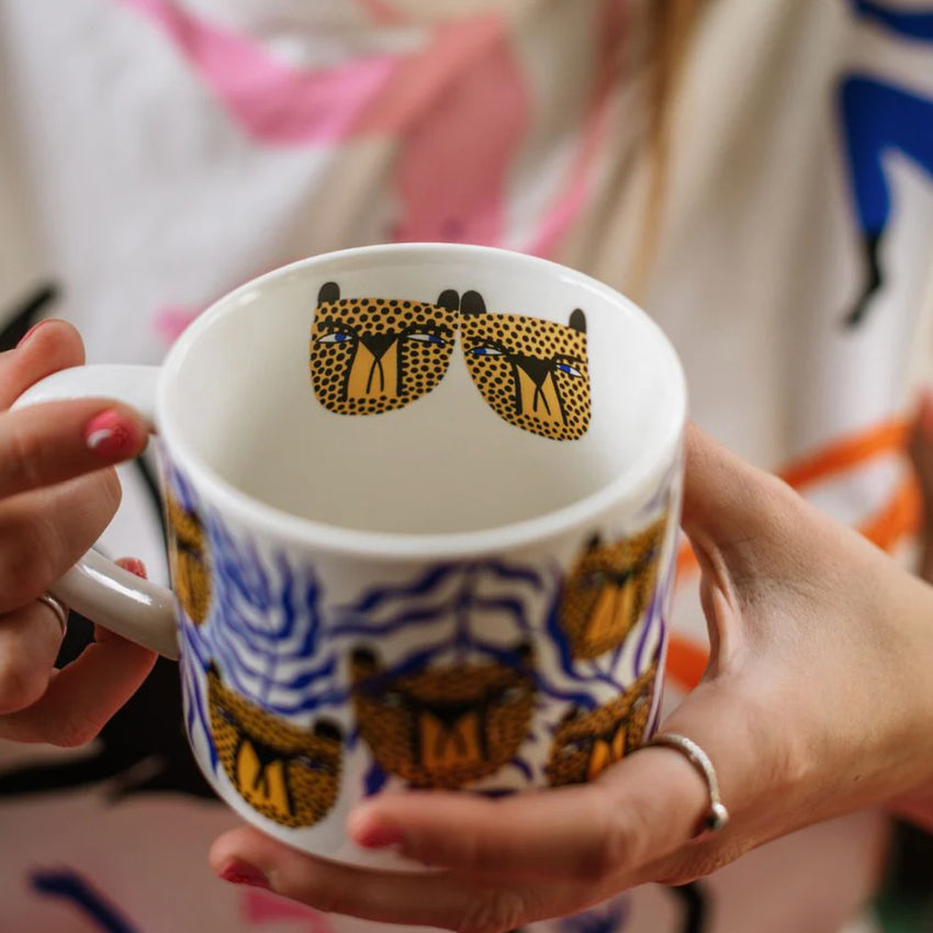 Person holding the Studio Soph Fuck Off Cup on a white background