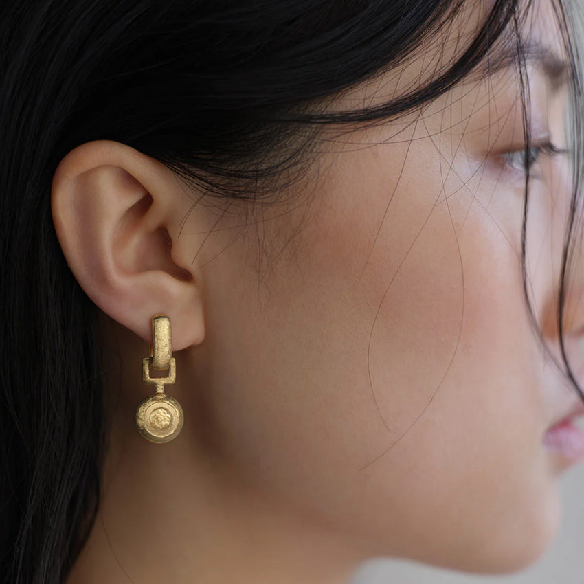 The Temple Of The Sun Alida Earrings in Gold Vermeil on a models ear