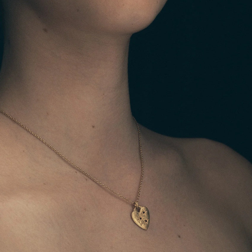The Temple Of The Sun Etti Necklace in Gold Vermeil on a model