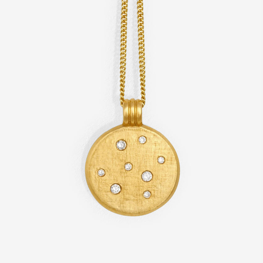 The Temple Of The Sun Nebula Necklace in Gold on a blank background