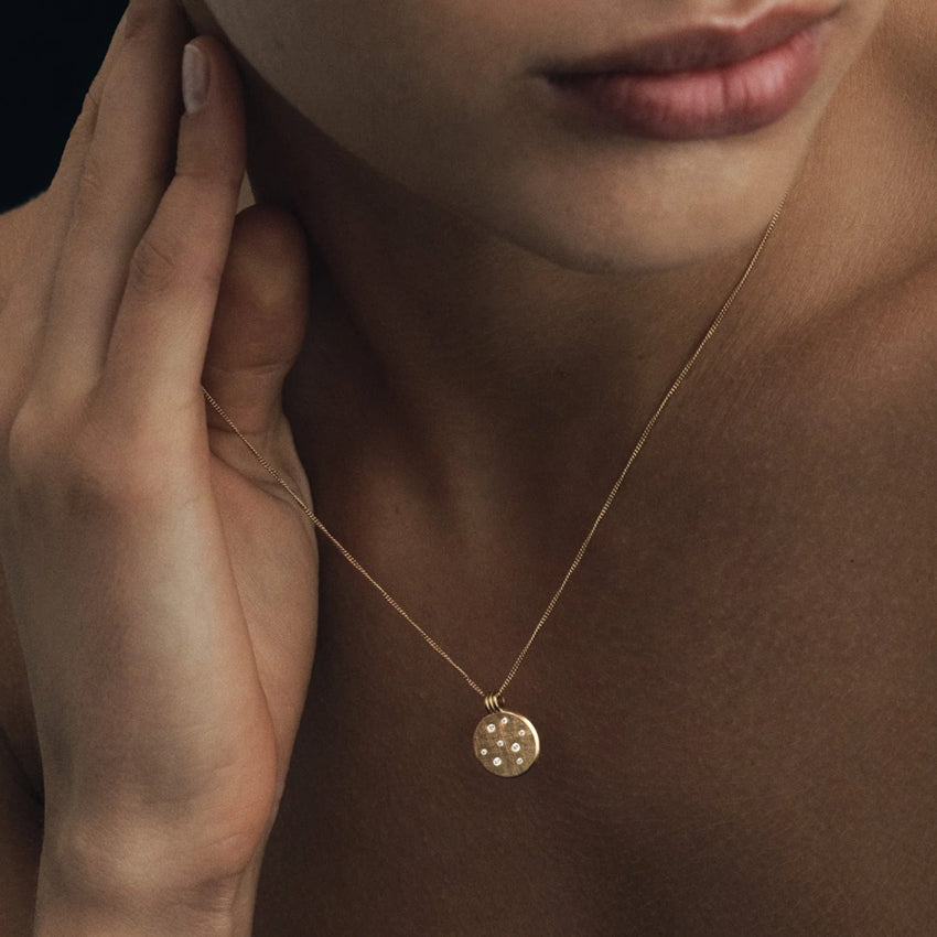The Temple Of The Sun Nebula Necklace in Gold on a model