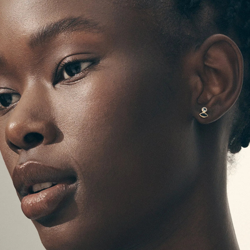 The Temple Of The Sun Sulis Studs in Gold Vermeil on a model