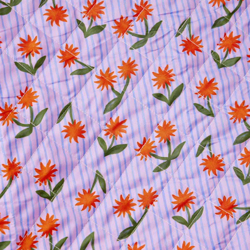 A closeup of the Somewhere Co XL Picnic Rug in Sunburst