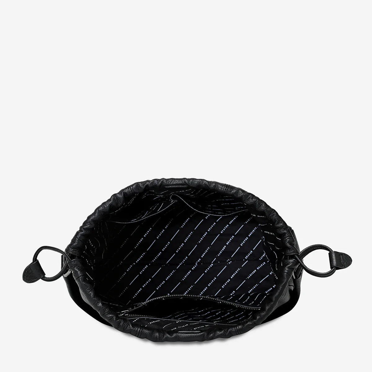 A top view of the inside of the Status Anxiety Point Of No Return Bag in Black on a blank background