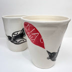 Two of the Amber Smith Piwakawaka and Tui Cups on a blank background 