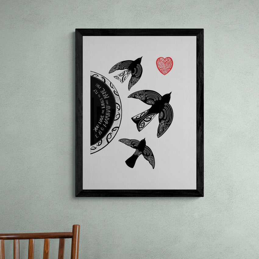 The Amber Smith Hei Rere Mai Art Print  in a black frame hanging on a green wall