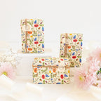 The Anoint Baby Shea Butter Soap Bars in a styled shot with flowers and ribbons
