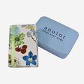 The Anoint Lavender and Bergamot Lotion Bar with tin on a blank background