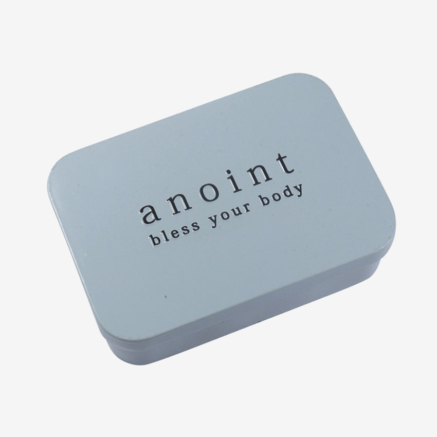 The Anoint Lotion Bar Tin on a blank background