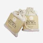 Two of the Anoint Oatmeal Bath Milks on a blank background