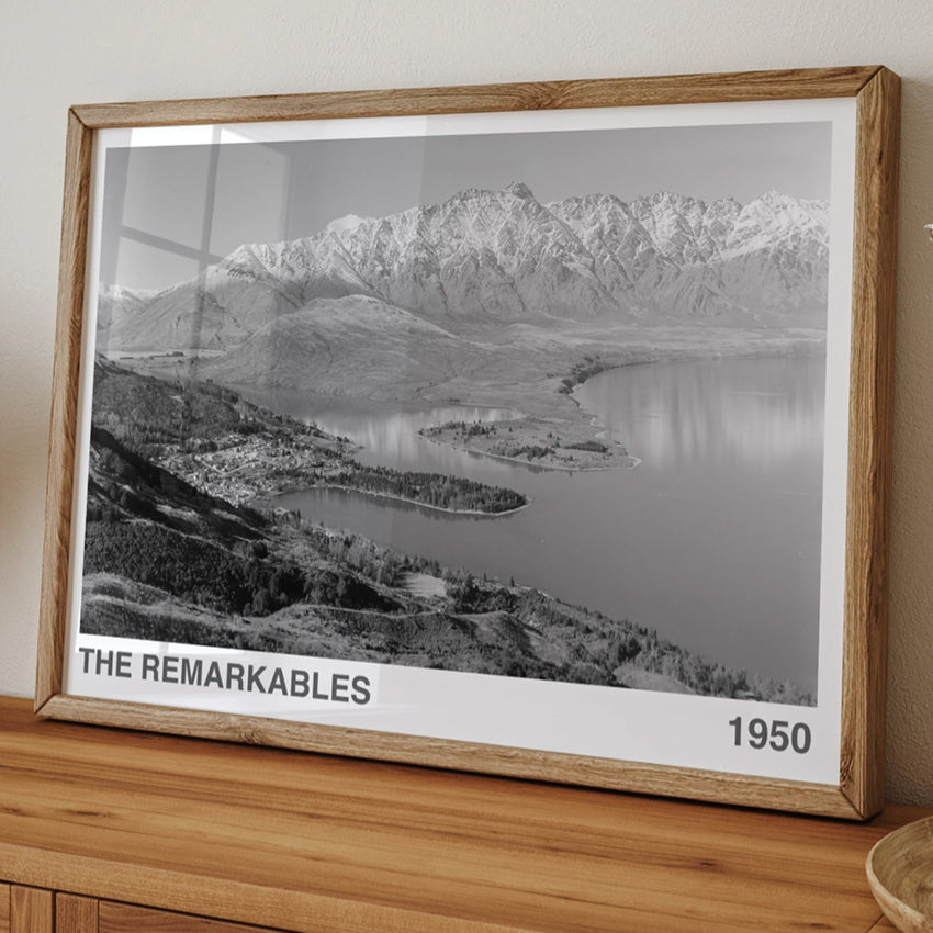 The ARTORY The Remarkables 1950 Art Print in a wooden frame on a console