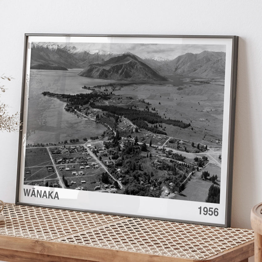 The ARTORY Wanaka 1956 Art Print in a black frame on a bench