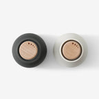 The top view of the small Audo Salt and Pepper Grinders in Ash, Carbon and Beech on a blank background