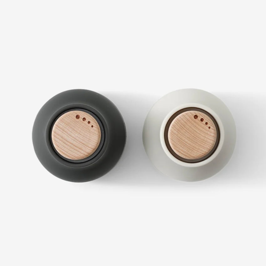 The top view of the small Audo Salt and Pepper Grinders in Ash, Carbon and Beech on a blank background