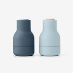 The Small Audo Salt and Pepper Grinder in Blues and Beech on a blank background