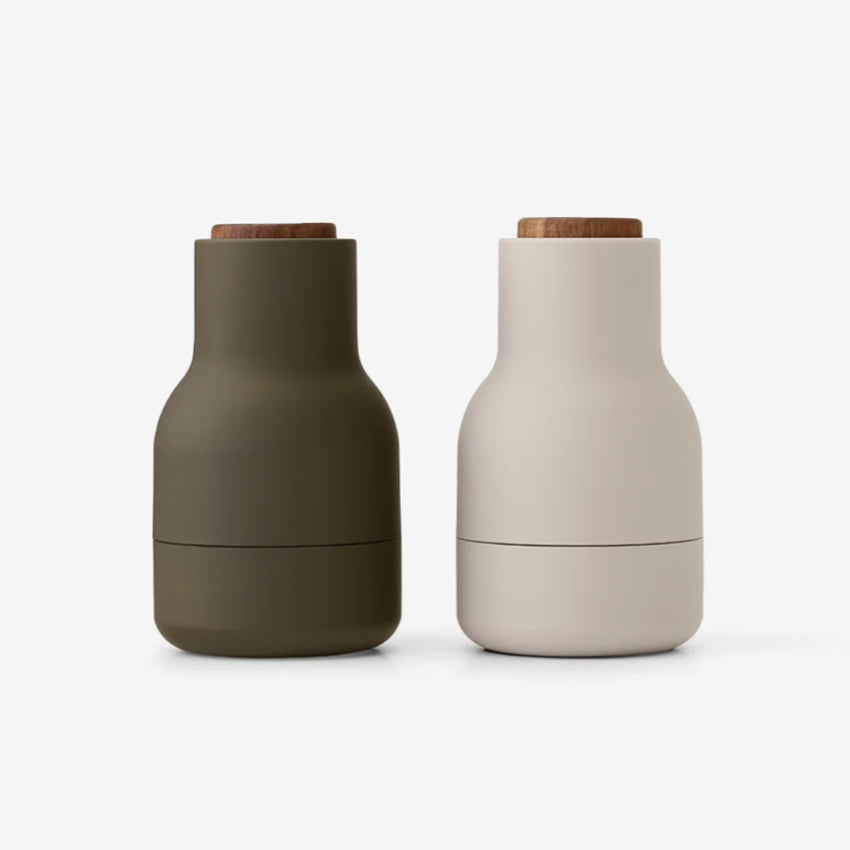 The Small Audo Salt and Pepper Grinder in Hunting Green and Walnut on a blank background