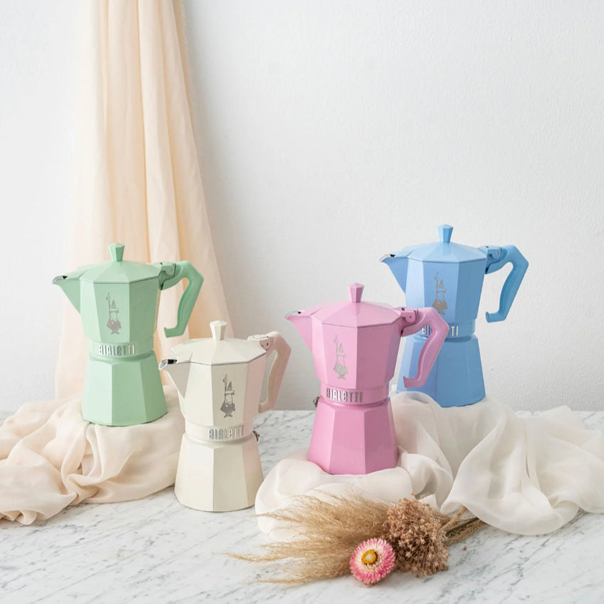 Four of the pastel coloured Bialetti Moka Exclusive Coffee Makers in a styled shot