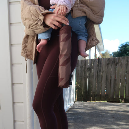 The Blunt Limited Edition Cocoa Metro Umbrella in its carry bag