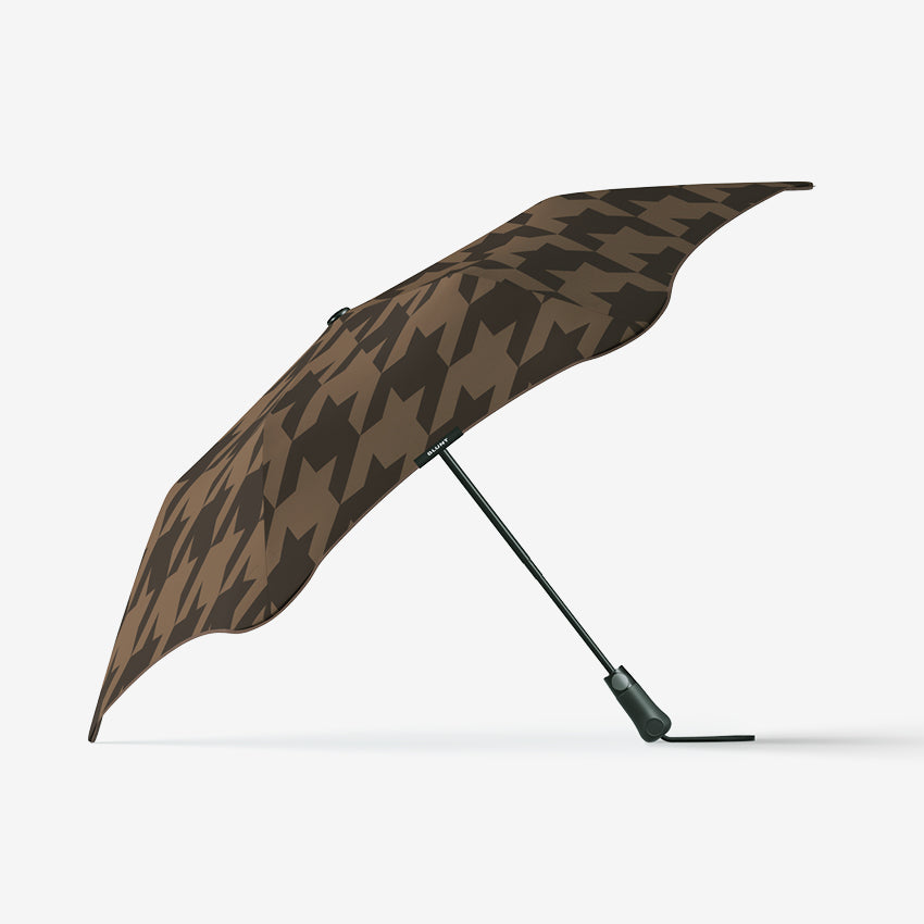 The Blunt Limited Edition Cocoa Metro Umbrella open on its side