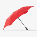 The Blunt Metro Umbrella in Red on a blank background