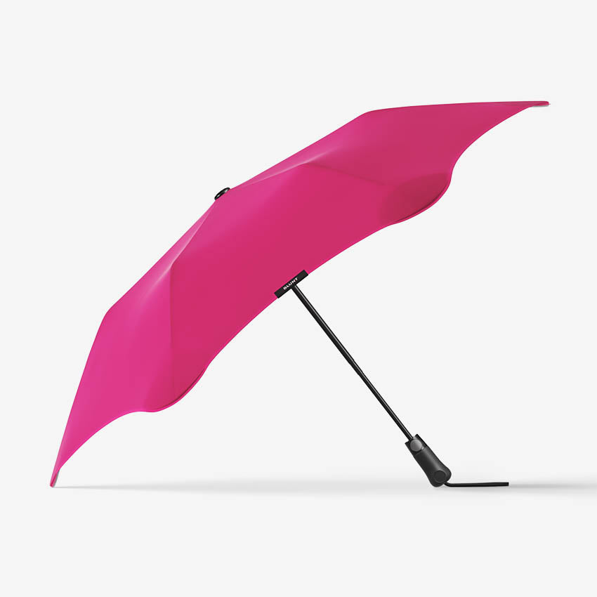 The Blunt Metro Umbrella in Pink on a blank background
