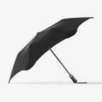 The Blunt Metro Umbrella in Black on a blank background