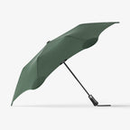The Blunt Metro Umbrella in Green on a blank background