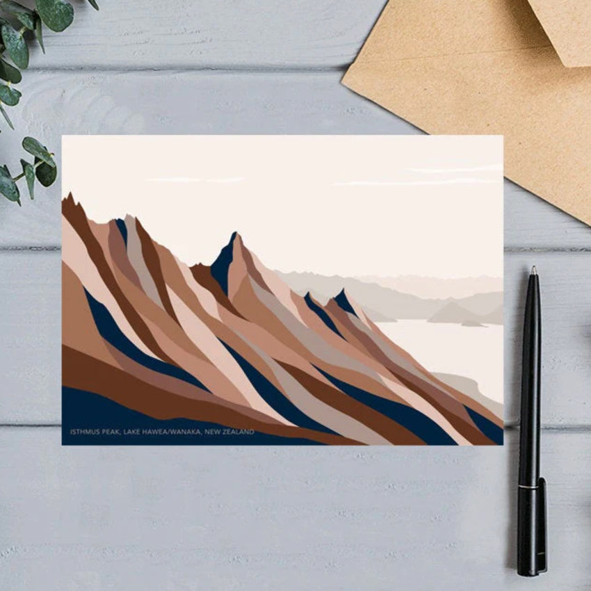 The Bridget Hall Designs Isthmus Peak Gift Card next to a pen and envelope